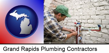 a plumbing contractor installing new water supply lines in Grand Rapids, MI