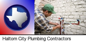 a plumbing contractor installing new water supply lines in Haltom City, TX