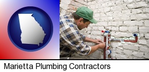 a plumbing contractor installing new water supply lines in Marietta, GA