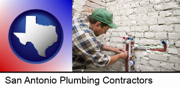 a plumbing contractor installing new water supply lines in San Antonio, TX
