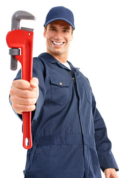 a plumber holding a red pipe wrench