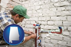 alabama map icon and a plumbing contractor installing new water supply lines