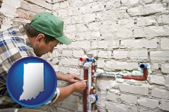 indiana map icon and a plumbing contractor installing new water supply lines