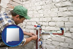 new-mexico map icon and a plumbing contractor installing new water supply lines