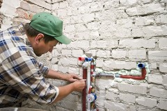 a plumbing contractor installing new water supply lines
