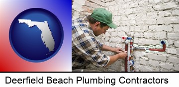 a plumbing contractor installing new water supply lines in Deerfield Beach, FL