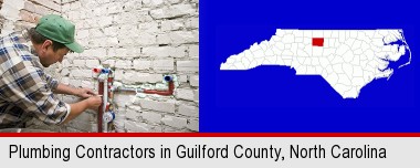 a plumbing contractor installing new water supply lines; Guilford County highlighted in red on a map